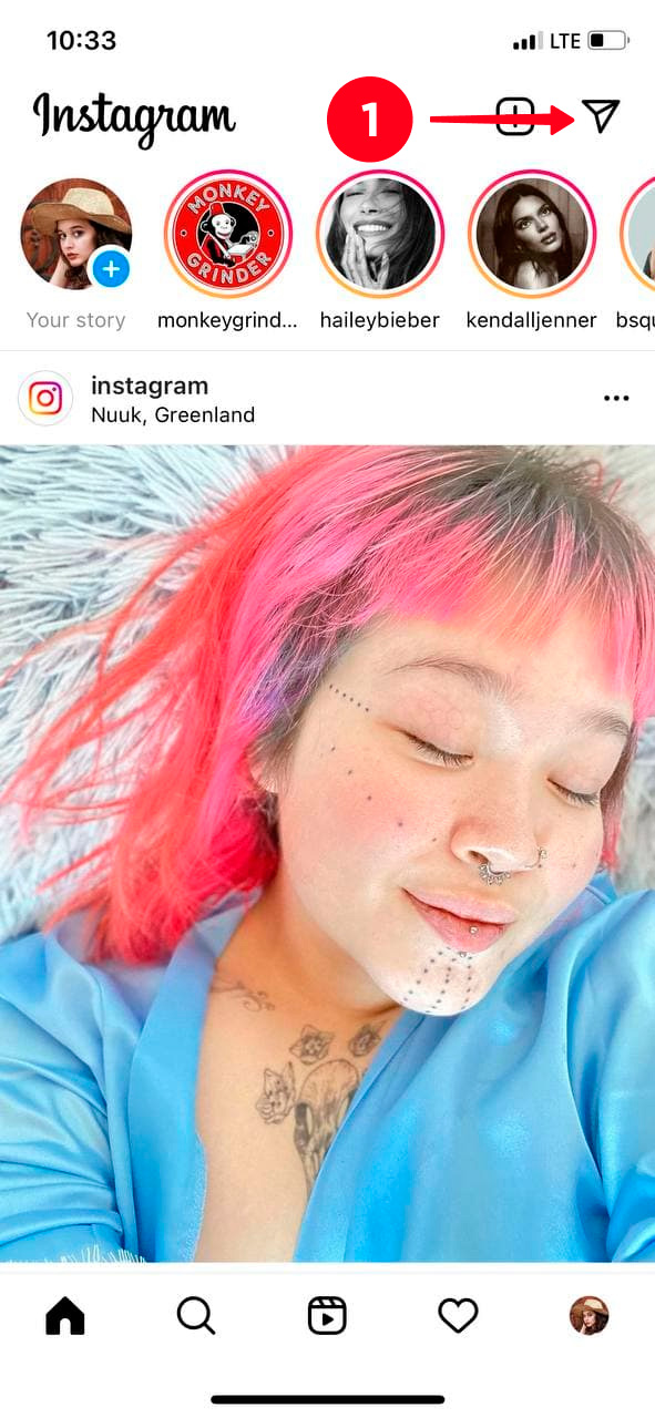 Tapping the paper plane in the Instagram home tab in the app